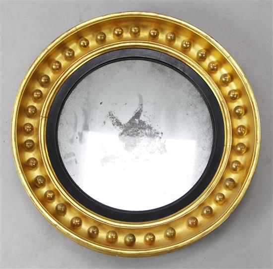 A Regency giltwood concave wall mirror, Diam. 1ft 10in.